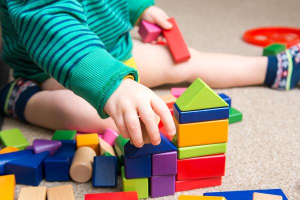 A toddler getting occupational therapy fine motor skills